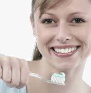 woman smiling with toothbrush